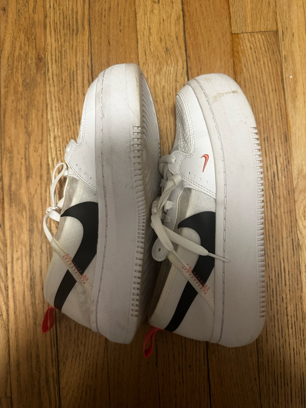 Nike White Low-Top Sneakers with Orange/Pink Insole Accents